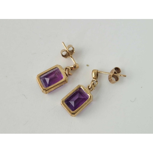 140 - A pair of amethyst earrings 9ct 2.9 gms