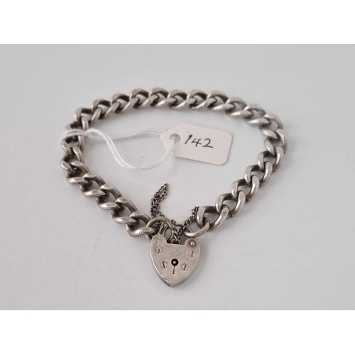 142 - A silver curb link bracelet with heart padlock, 29 g