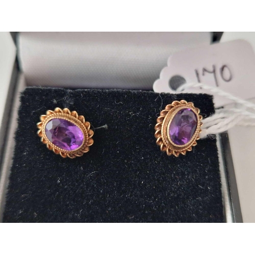 170 - A pair of amethyst earrings 9ct boxed