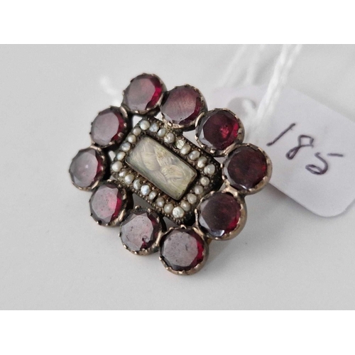 185 - A 19th century oblong garnet and pearl mourning brooch