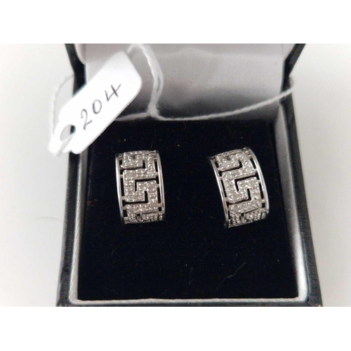 204 - A pair of white gold huggie Earrings 9ct 3.1 gms boxed