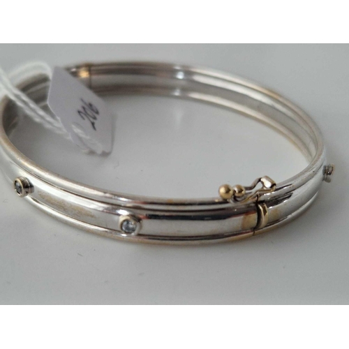 206 - A WHITE GOLD BANGLE 9CT 10.1 GMS