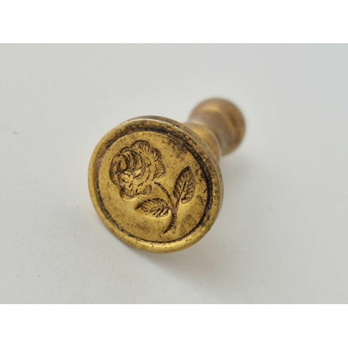 229 - A pinchbeck small hand seal with rose intaglio