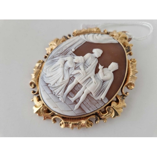 27 - A ANTIQUE GOLD MOUNTED CAMEO BROOCH DEPICTING A CLASSICAL THEME 62MM X 73MM