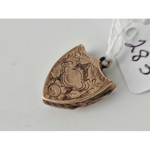 283 - A gold back and front shield shaped locket 2.5 gms