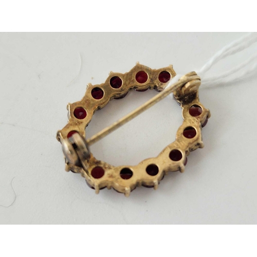 29 - A oval gold mounted garnet brooch