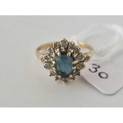 30 - A diamond and blue stone oval cluster ring 9ct size R