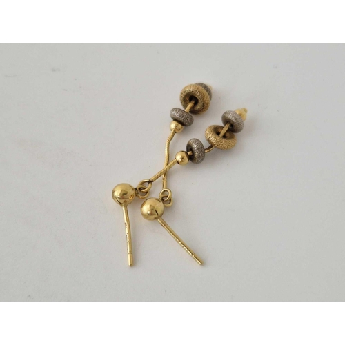 31 - A pair of 18ct gold ear drops 2.7 gms