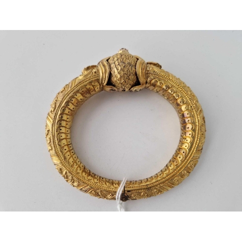 310 - A middle eastern gold gilt KADA hinged bracelet