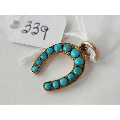 339 - A turquoise horse shoe pendant 15ct gold 1.9 gms