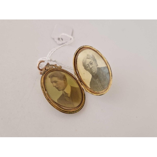 367 - An engraved oval back and front gold locket, 5.7 g