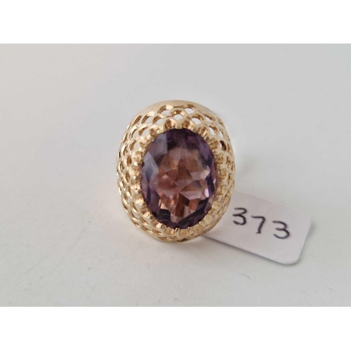 373 - A amethyst set pierced design bombe ring 9ct size M