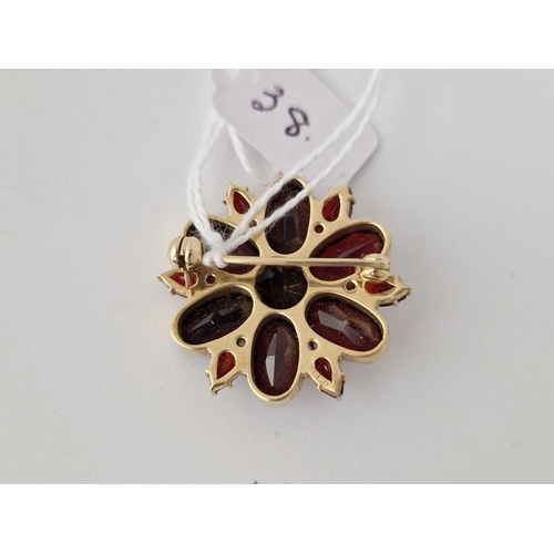 38 - A garnet cluster brooch 9ct 8.8 gms