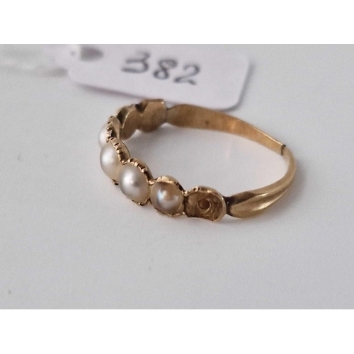 382 - An antique gold pearl set ring (cut shank), size J, 1.5 g