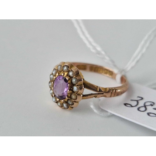 385 - An amethyst and pearl cluster ring, set in gold, size O, 2g.