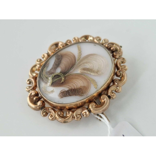 436 - A Victorian gold mourning photo locket brooch