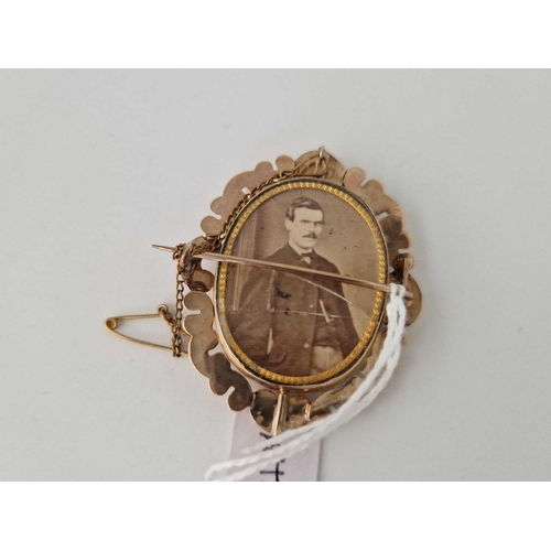 436 - A Victorian gold mourning photo locket brooch