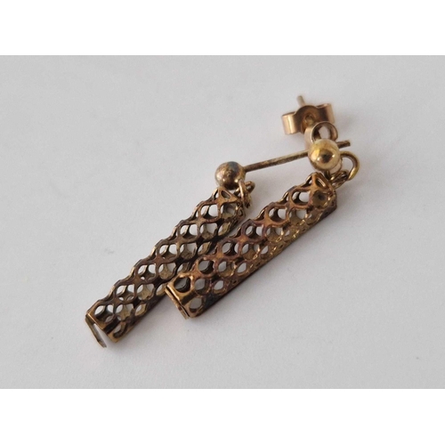 444 - A pair of oblong pierced earrings, set in gold, 1.3 g