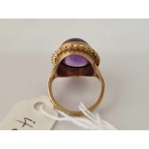 45 - An amethyst cabochon ring, 9ct, size K 1.5, 5.1 g