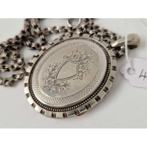 456 - A Victorian locket on silver chain, 18.5 inch