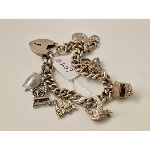 457 - A silver charm bracelet, 40 g.