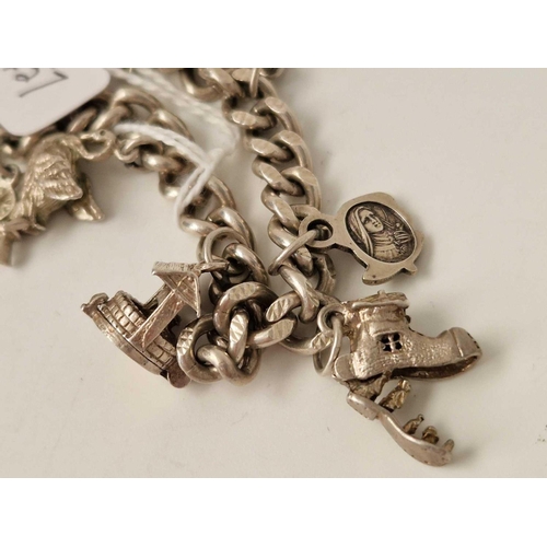 457 - A silver charm bracelet, 40 g.