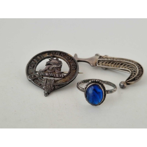 478 - A bag of three silver items a filagree dagger brooch and a butterfly wing ring and silver military b... 