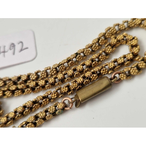 492 - An antique gilt metal chain with flat clasp, 16 inch