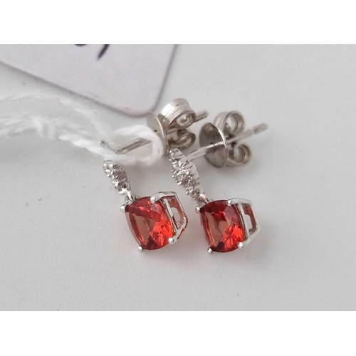 501 - A pair of diamond and red stone drop earrings 9ct