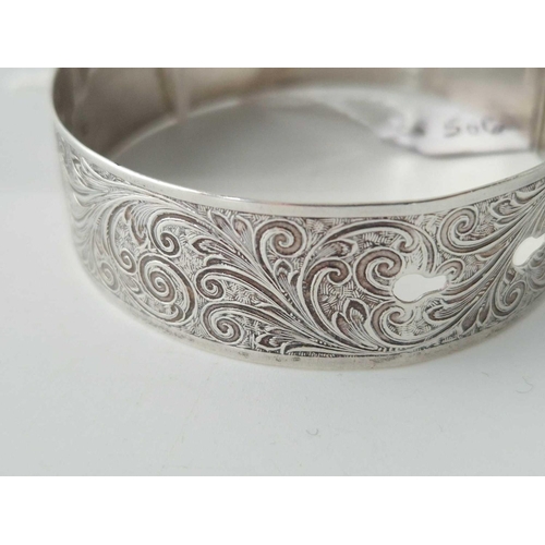 506 - A wide sterling silver buckel bangle 22 gms