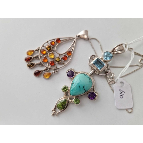 510 - A large silver turquoise amethyst topaz and peridot pendant together with a amber example