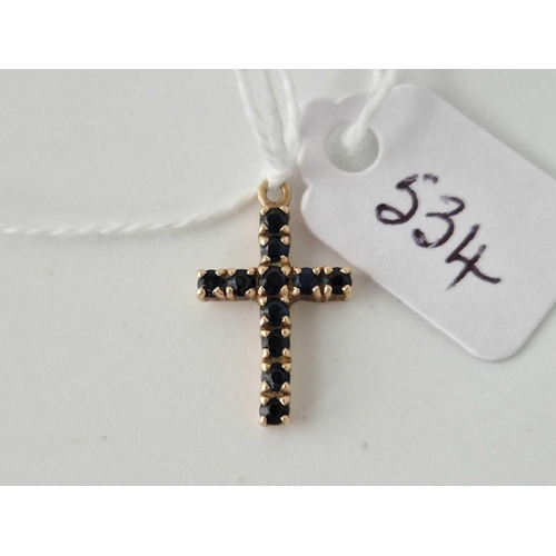 534 - A sapphire cross 9ct