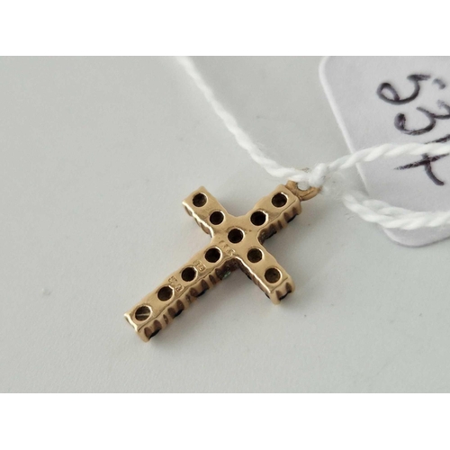 534 - A sapphire cross 9ct