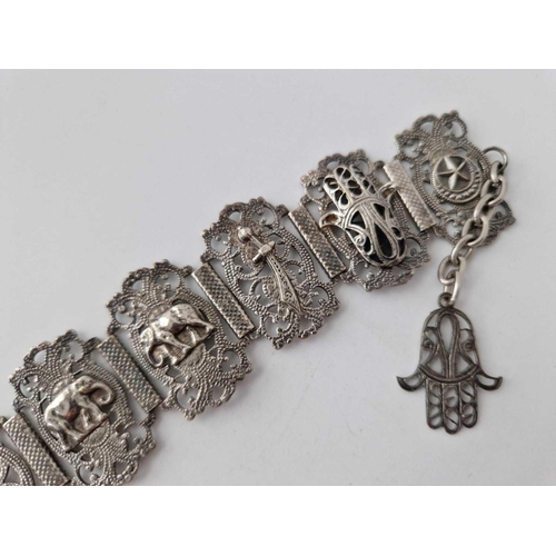 547 - An Indian silver bracelet with Hamza Hand drop, 27 g