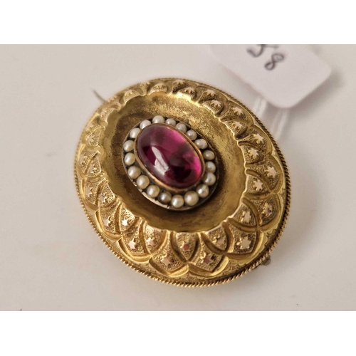 58 - A Victorian cabochon garnet and pearl brooch with locket back, 15ct tested, 9.8 g