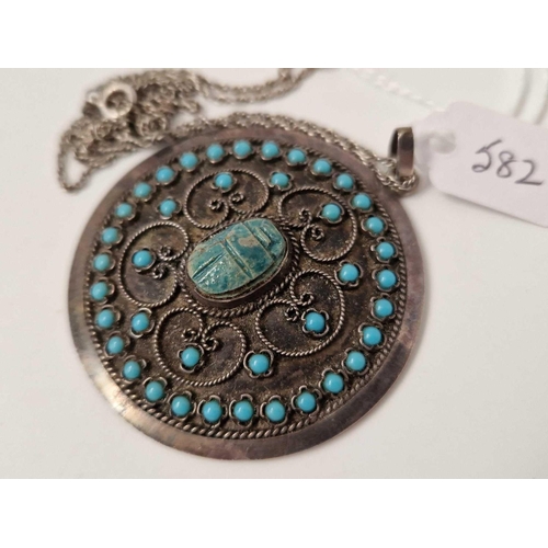 582 - A silver scarab and turquoise pendant on silver chain