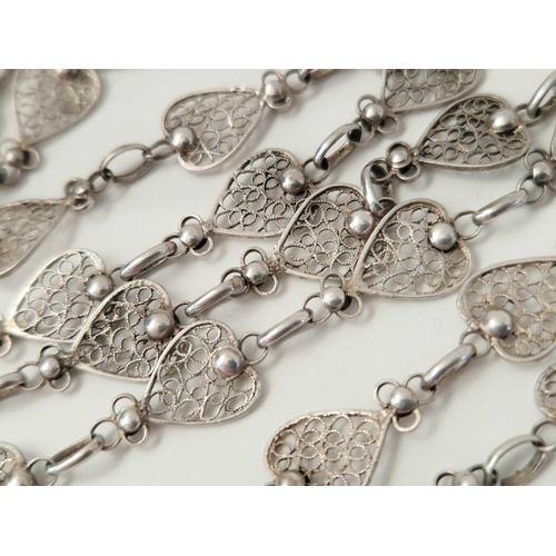 592 - A long silver filigree neck chain,  58 inch, 34 g