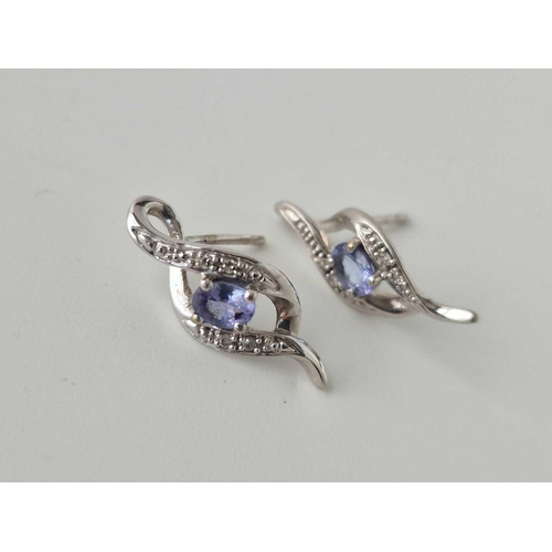 602 - A white gold diamond and tanzernite earrings