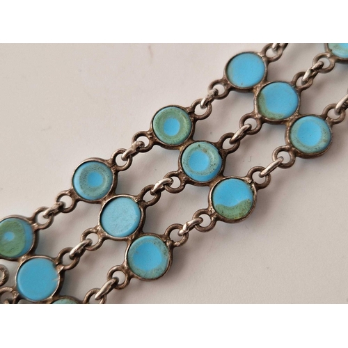 603 - A silver bracelet set with three rows of turquoise 6.5 inches