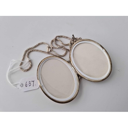 637 - A large silver locket on silver chain, 24.5 inch, 31 g.