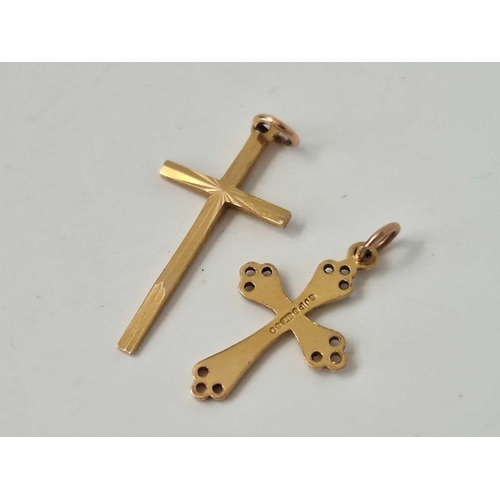 643 - Two 9ct crosses