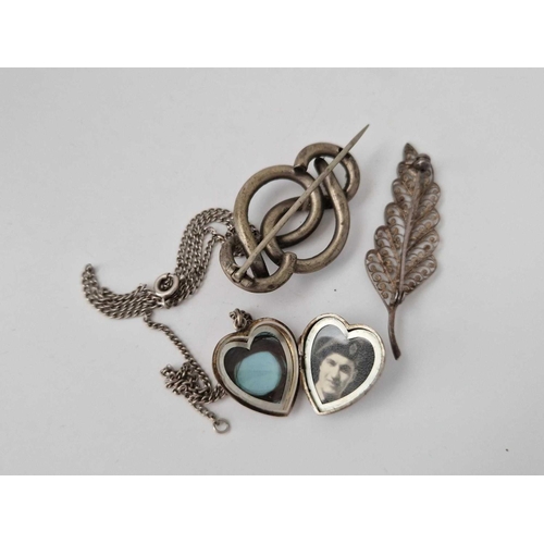 657 - Two silver brooches and locket