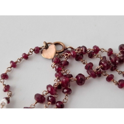 664 - A pretty garnet bead necklace 9ct 48 inch