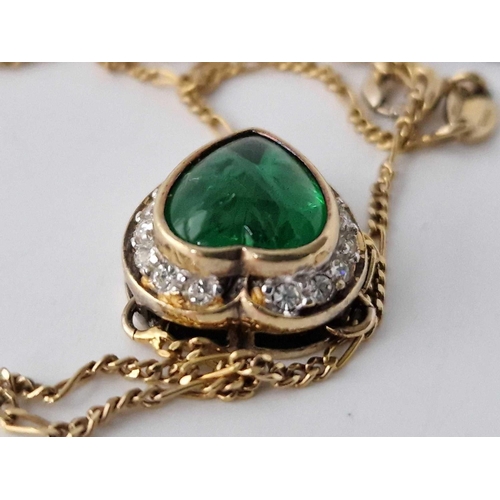 665 - A silver gilt heart shaped green stone pendant necklace