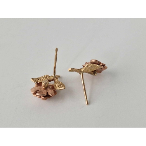 668 - A pair of two colour gold earrings 9ct