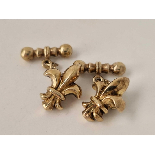 689 - A pair of silver gilt fleur de lis