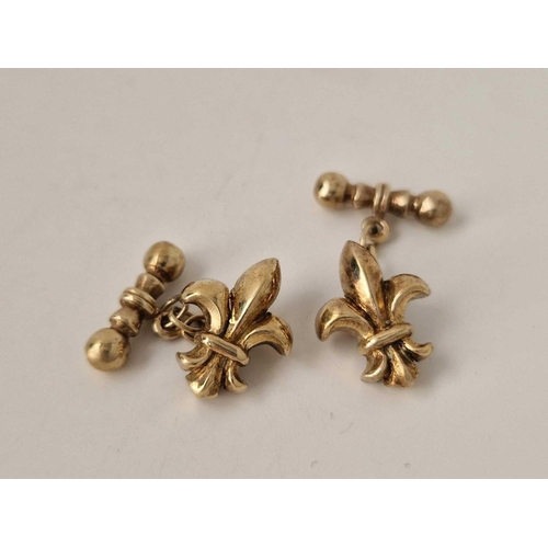 689 - A pair of silver gilt fleur de lis