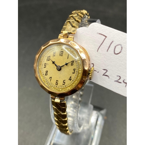 710 - A ladies Buren wrist watch, 9ct, on flexible metal strap