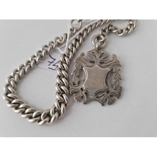 74 - A silver watch Albert chain and medallion 41.8g