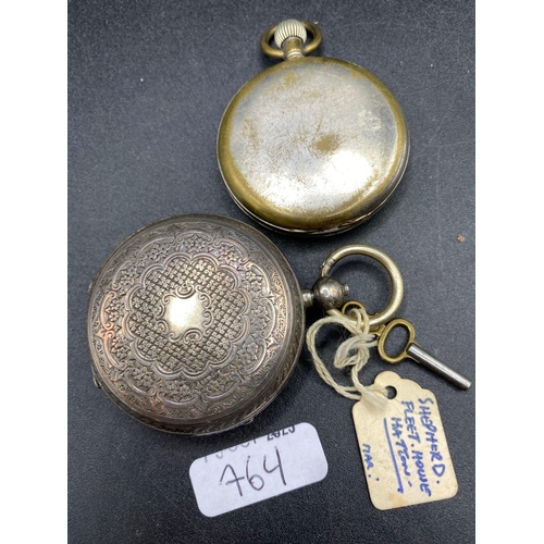 764 - An engraved back gents pocket watch, together with a metal Tiegra watch